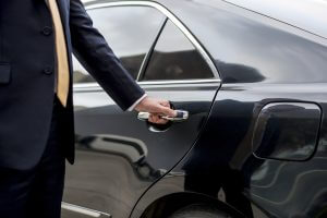 lifestyle concierge opening a car door