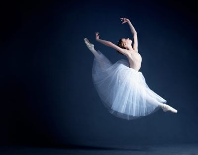 ballerina against a dark background